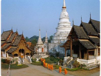 ca. 1980-1995, Chiang Mai, Thailand --- Monks near Phra Wiharn Lai Kam in Chaing Mai, Thailand --- Image by © Luca I. Tettoni/CORBIS